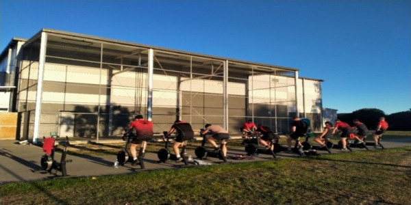 Burnham Gym with personnel on exercise bikes outside