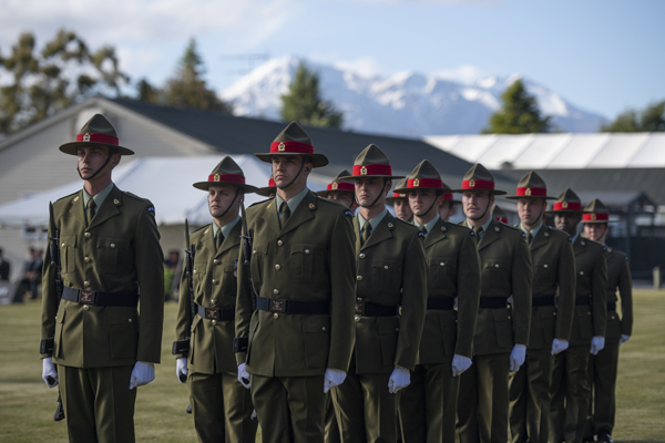 Soldiers on parade with the mountains in the background