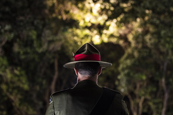 Army personnel in uniform, viewed from behind