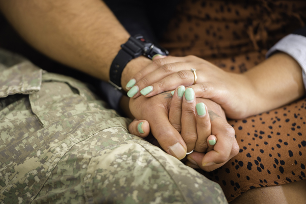 Two people holding hands